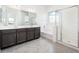 Bright bathroom with dual sinks, a separate shower, and a soaking tub at 25519 W Brookhart Way, Wittmann, AZ 85361