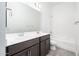 Bright bathroom with double vanity and ample lighting at 25519 W Brookhart Way, Wittmann, AZ 85361