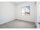 Bright bedroom with carpet flooring and a view of the neighborhood at 25519 W Brookhart Way, Wittmann, AZ 85361