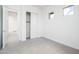 Cozy bedroom featuring carpet flooring and walk-in closet at 25519 W Brookhart Way, Wittmann, AZ 85361