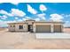 An inviting single-story home with a neutral color scheme and a spacious three-car garage at 25519 W Brookhart Way, Wittmann, AZ 85361