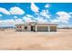 An inviting single-story home with a neutral color scheme and a spacious three-car garage at 25519 W Brookhart Way, Wittmann, AZ 85361