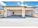 Spacious three-car garage with ample parking space and clean, modern design at 25519 W Brookhart Way, Wittmann, AZ 85361