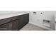 Functional laundry room with cabinets, counter space, and utility connections at 25519 W Brookhart Way, Wittmann, AZ 85361