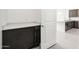 Practical mud room featuring cabinetry and adjacent to the kitchen at 25519 W Brookhart Way, Wittmann, AZ 85361