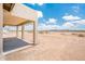 Covered patio features a neutral color palette and ample natural light with a view of the lot at 25519 W Brookhart Way, Wittmann, AZ 85361