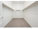 Walk-in closet with built-in shelving and ample storage space at 25519 W Brookhart Way, Wittmann, AZ 85361