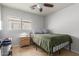 Bright bedroom with double bed, nightstand, and ceiling fan at 2602 W Roeser Rd, Phoenix, AZ 85041