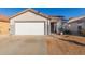 House exterior features a white garage door, landscaping, and a paved driveway at 2602 W Roeser Rd, Phoenix, AZ 85041