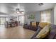 Spacious living room with tile floors, gray sectional sofa, and a ceiling fan at 2602 W Roeser Rd, Phoenix, AZ 85041