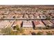 Aerial view showcasing a house's backyard and surrounding homes in a residential area at 2629 E Santa Maria Dr, Casa Grande, AZ 85194