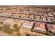 Aerial view showcasing a house's backyard and surrounding homes in a residential area at 2629 E Santa Maria Dr, Casa Grande, AZ 85194