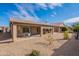 Home exterior showcasing a large backyard and covered patio at 2629 E Santa Maria Dr, Casa Grande, AZ 85194