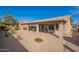 Home exterior with a spacious backyard and covered patio at 2629 E Santa Maria Dr, Casa Grande, AZ 85194