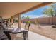 Spacious backyard with gravel landscaping and a covered patio at 2629 E Santa Maria Dr, Casa Grande, AZ 85194