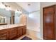 Bathroom with double sinks, bathtub, and linen closet at 2629 E Santa Maria Dr, Casa Grande, AZ 85194