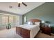 Well-lit bedroom with wood furniture and large window at 2629 E Santa Maria Dr, Casa Grande, AZ 85194