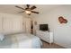 Bedroom with a double door closet and TV at 2629 E Santa Maria Dr, Casa Grande, AZ 85194