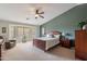 Spacious bedroom with wood furniture and bay window at 2629 E Santa Maria Dr, Casa Grande, AZ 85194