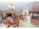 Bright dining area with a wood table and chairs, adjacent to kitchen at 2629 E Santa Maria Dr, Casa Grande, AZ 85194