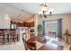 Bright dining area with wood table and chairs, near kitchen at 2629 E Santa Maria Dr, Casa Grande, AZ 85194