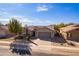 Single-story house with tile roof and desert landscaping, two-car garage at 2629 E Santa Maria Dr, Casa Grande, AZ 85194