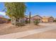 One-story home with a two-car garage and desert landscaping at 2629 E Santa Maria Dr, Casa Grande, AZ 85194