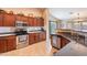 Modern kitchen with stainless steel appliances and wood cabinets at 2629 E Santa Maria Dr, Casa Grande, AZ 85194