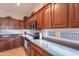 Modern kitchen with stainless steel appliances and wood cabinets at 2629 E Santa Maria Dr, Casa Grande, AZ 85194