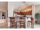 Breakfast bar with two chairs in a modern kitchen at 2629 E Santa Maria Dr, Casa Grande, AZ 85194