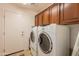 Laundry room with washer, dryer, and cabinets at 2629 E Santa Maria Dr, Casa Grande, AZ 85194