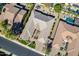 Overhead view of a house with a unique roofline, surrounded by other homes and a pool at 2952 E Warbler Rd, Gilbert, AZ 85297