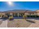 View of the home's backyard, featuring a patio and landscaping at 2952 E Warbler Rd, Gilbert, AZ 85297