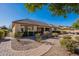 Landscaped backyard with a brick pathway leading to the patio at 2952 E Warbler Rd, Gilbert, AZ 85297