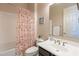 Bathroom with a tub, shower, and cheerful decor at 2952 E Warbler Rd, Gilbert, AZ 85297