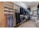 Large walk-in closet with ample shelving and hanging space at 2952 E Warbler Rd, Gilbert, AZ 85297