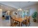 Bright dining area with wood table and chairs, adjacent to kitchen at 2952 E Warbler Rd, Gilbert, AZ 85297