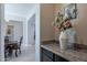 Elegant dining room with a dark wood table and chairs, offering a formal and sophisticated space at 2952 E Warbler Rd, Gilbert, AZ 85297