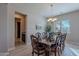 Formal dining room with wood table and six chairs at 2952 E Warbler Rd, Gilbert, AZ 85297