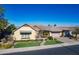 Single-story house with a neutral color scheme, landscaping, and a paved driveway at 2952 E Warbler Rd, Gilbert, AZ 85297