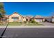 Beautiful single-story home with a landscaped yard and two-car garage at 2952 E Warbler Rd, Gilbert, AZ 85297