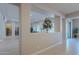 Open hallway with view into living room through architectural opening at 2952 E Warbler Rd, Gilbert, AZ 85297