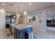 Kitchen island with granite countertop and stainless steel appliances at 2952 E Warbler Rd, Gilbert, AZ 85297