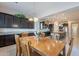 Spacious kitchen with dark cabinetry, granite counters, and stainless steel appliances at 2952 E Warbler Rd, Gilbert, AZ 85297