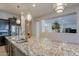 Kitchen island with granite countertops and modern sink at 2952 E Warbler Rd, Gilbert, AZ 85297