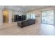 Living room with sectional sofa and wood floors at 2952 E Warbler Rd, Gilbert, AZ 85297