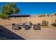 Patio with seating area and umbrella, offering a relaxing space at 2952 E Warbler Rd, Gilbert, AZ 85297