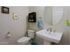 Clean and modern powder room with pedestal sink and toilet at 3020 N 165Th Ave, Goodyear, AZ 85395