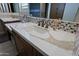 Bathroom vanity with quartz countertop and modern fixtures at 3020 N 165Th Ave, Goodyear, AZ 85395