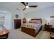 Main bedroom with a wooden bed frame and southwestern bedding at 3020 N 165Th Ave, Goodyear, AZ 85395